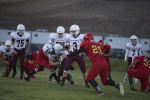 Slater Wade carries the ball for a first down. 