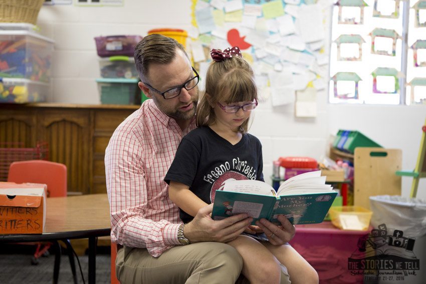 FC parent Jason Geil, reads a picture books with his daughter Olivia Geil in class for Dads Day, Feb. 26.