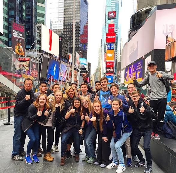 One of the first things The Feather Staffers did in New York was to pause to take in  Times Square and take a group photo. 