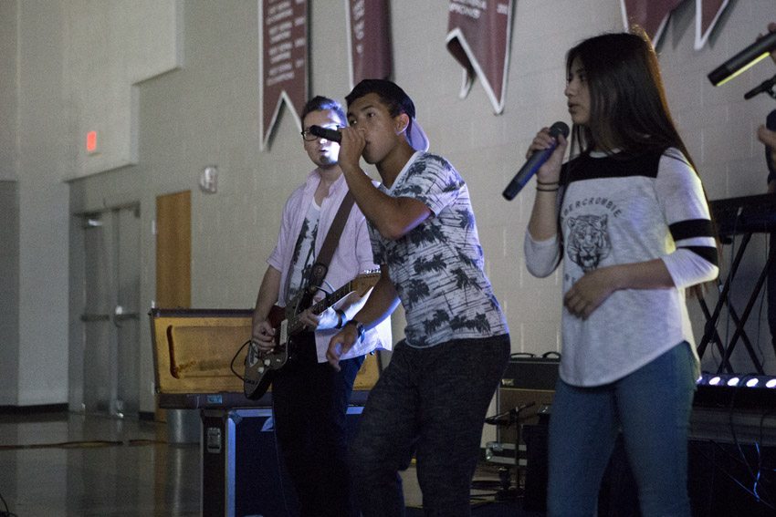 Sophomores Tyler Villines and Melissa Tostado lead the student body in worship during the last chapel the year, May 19.