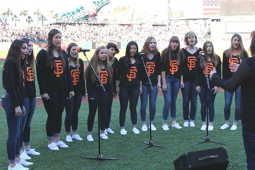 Bellezza ensemble sings during the SF Giants game