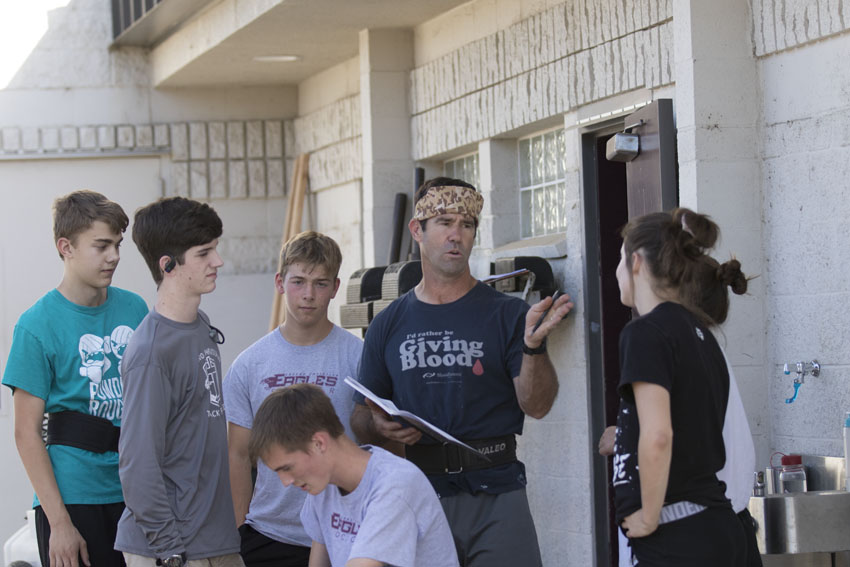PE teacher Mick Fuller instructs students during Barbell Club, Sept. 24.