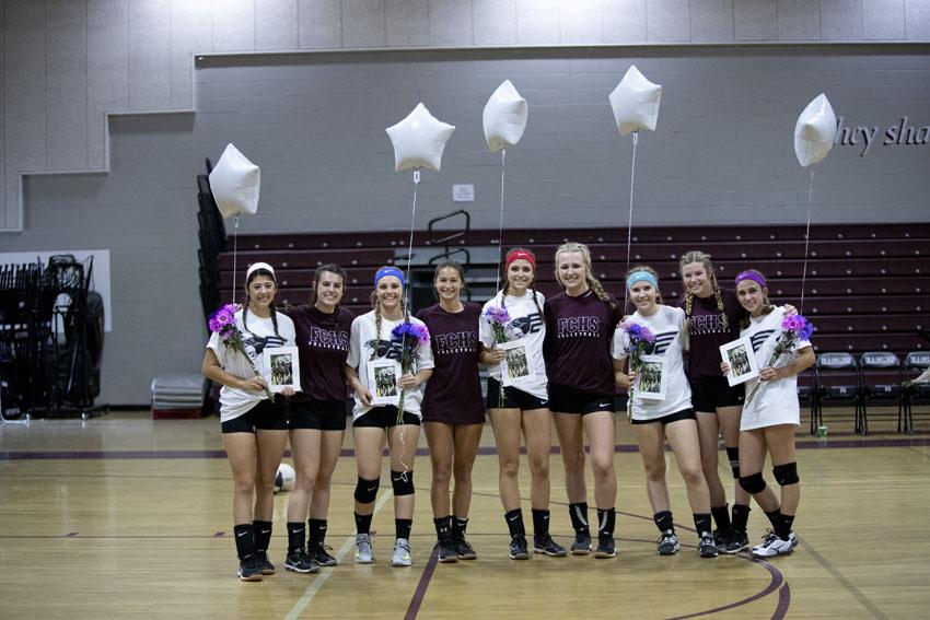 The+varsity+girls+volleyball+team+celebrates+and+acknowledges+seniors+on+the+team%2C+Oct.+18.