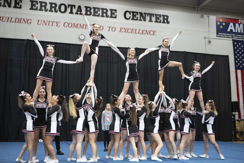 The cheer team competing in division II, placed fourth in their last competition.