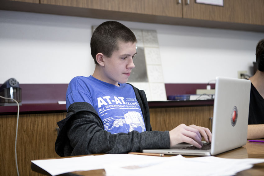 Freshman David Tuck beings writing a five page journal about a character in The Great Depression during seventh period U.S history, Feb. 27.