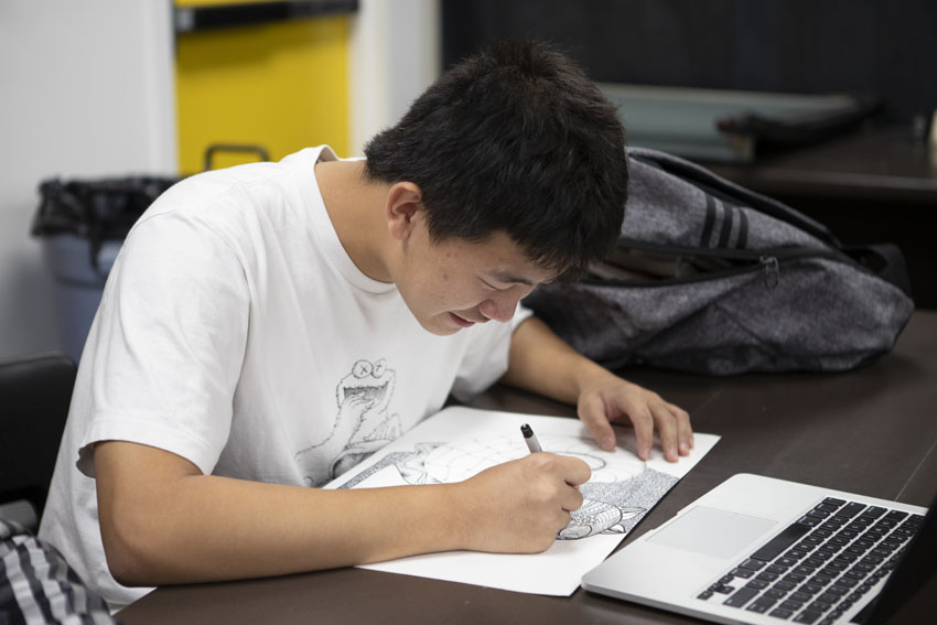 Luke (Zeilang) Wu, '20, feels he has improved his English and communicative skills through The Feather.