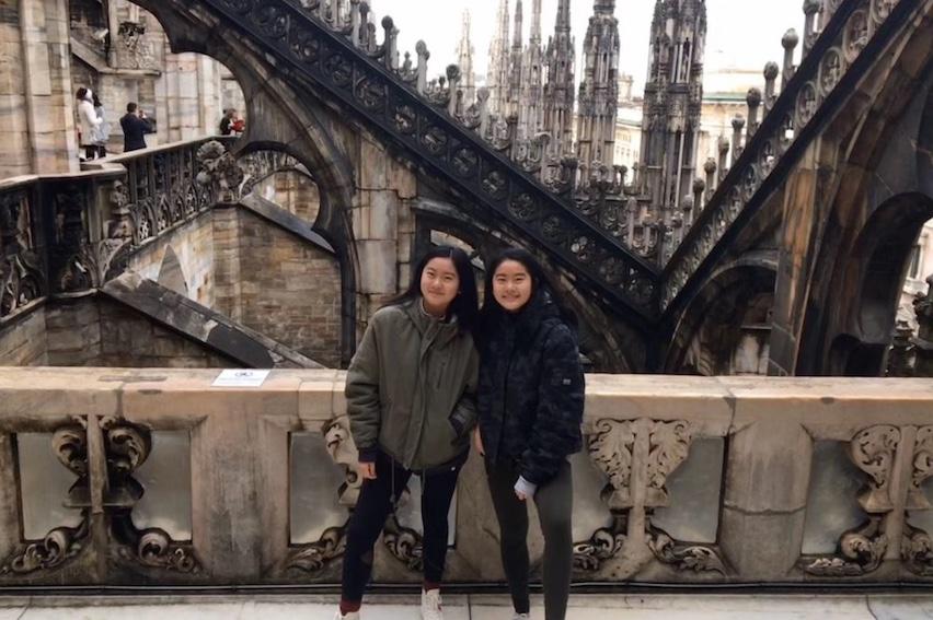 Twin sisters Mingyu(Mia) and Haoyu (Cara) Zhu touring duomo di Milano, a catholic Church in Italy.