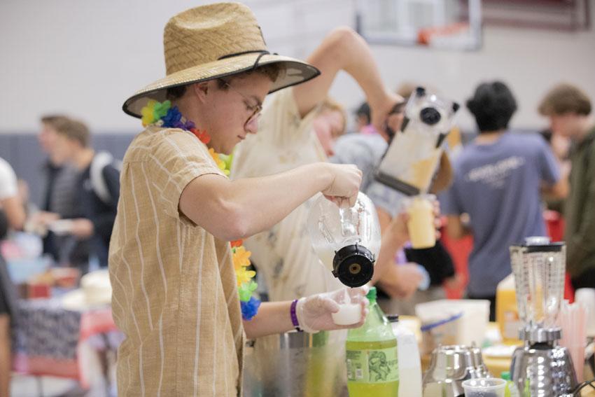 Senior, Max Hinton prepares his smoothies for students to buy.