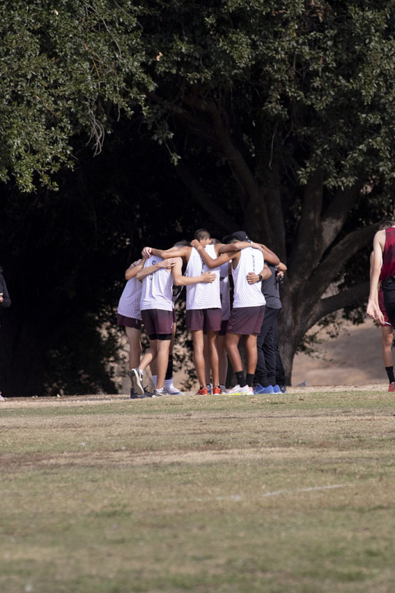 The boys group huddle and pray before their big run.