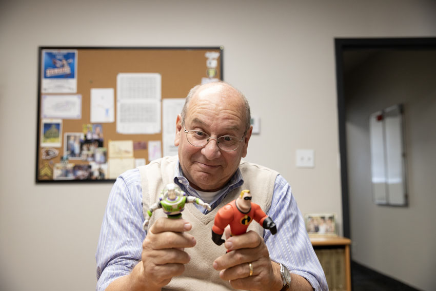 Bible teacher Scott Falk collects many figurines and bobble heads that are often used as objects in his life lessons. 