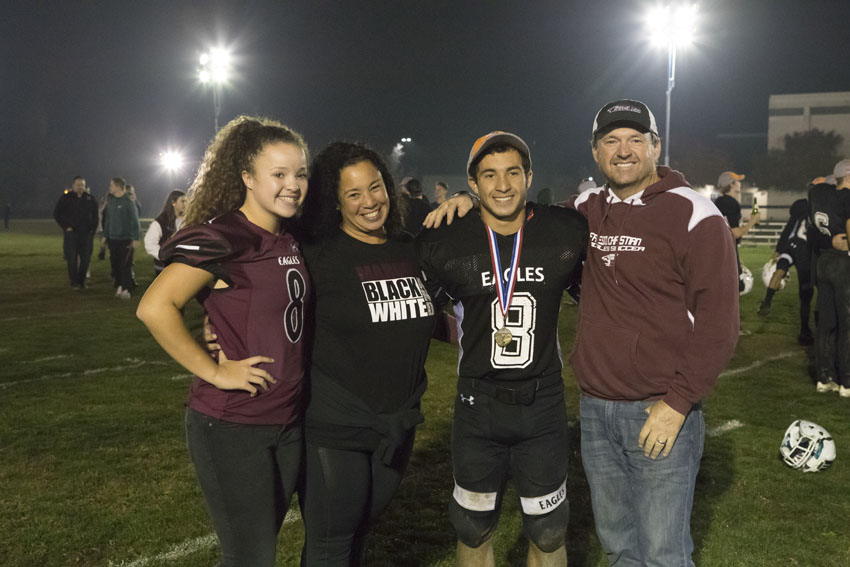 Tyler Villines and his family celebrate the end of his high school football career, Nov. 2018.