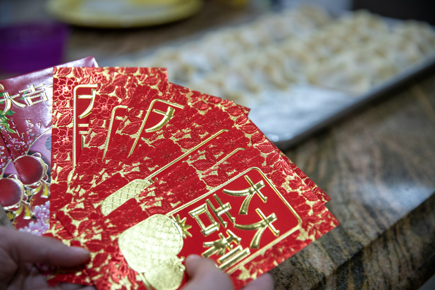 One of the many traditions is to give out red envelopes with money inside as gifts to kids and adults.. 