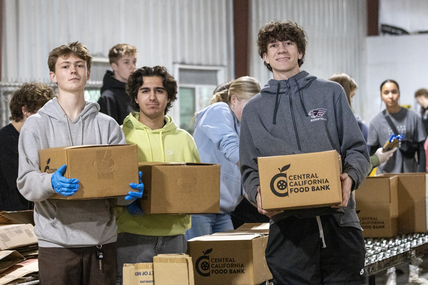 Students help transport food boxes on Serve Day, March 8.