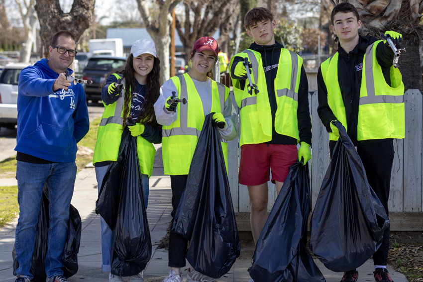 Students and Staff pick up trash to serve the community, March 8.