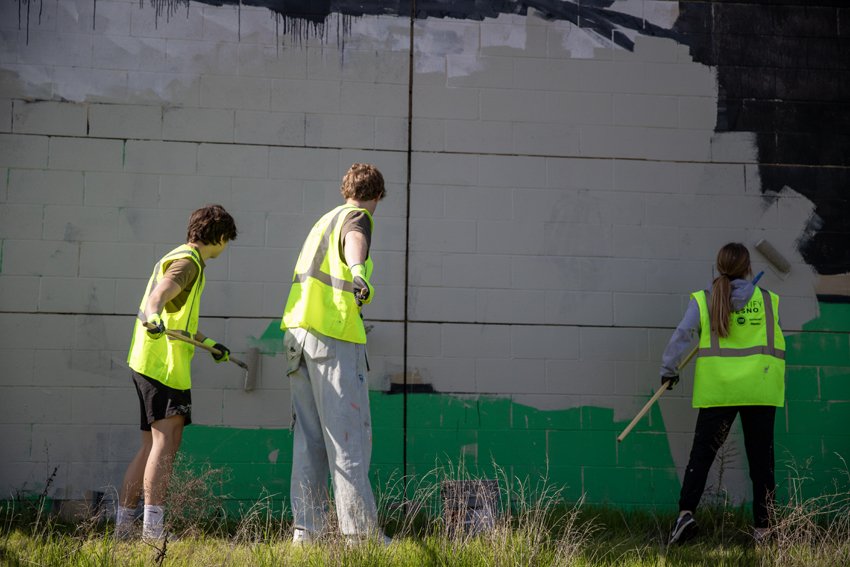 Seniors paint over graffiti during Serve Day, March 8.