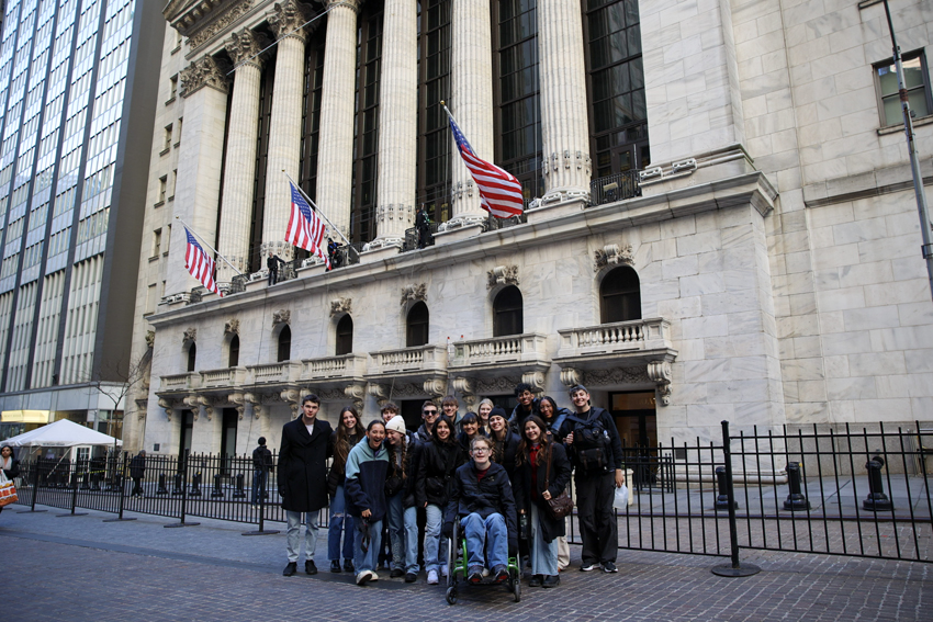 Team Photo in-front of the New York stock exchange building