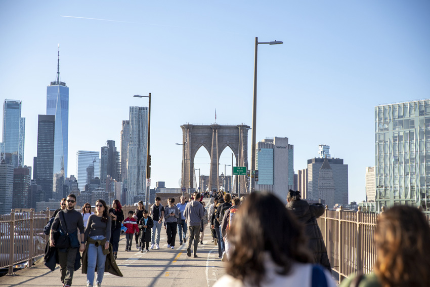 15 Feather students walk one mile across Brooklyn bridge on their way home for Broadway, March 13. 