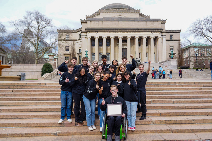 The New York team gathers in front of the Library at Columbia following the CSPA award ceremony, where they won their sixth Silver Crown. 