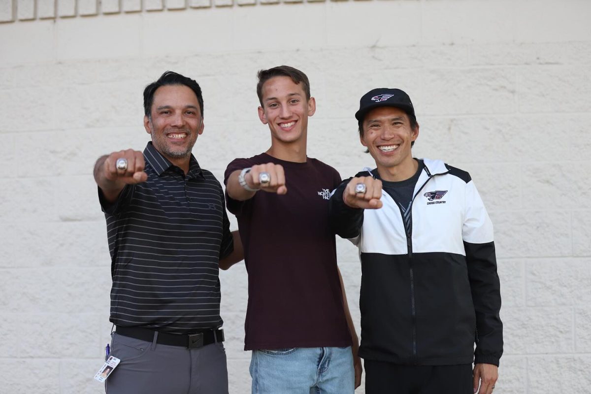 Freshman Blake Bay was presented his Championship Ring by his Coaches James Garcia and Shawn Young for taking first in CIF State Cross Country Championship.