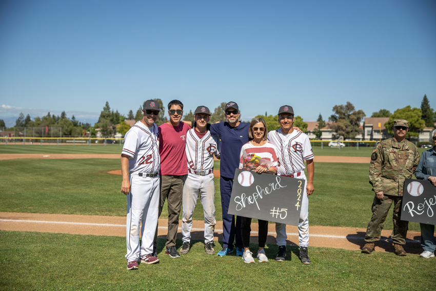 Paul Sheppard poses with his family and coach as they celebrate Senior Night together, May 7.