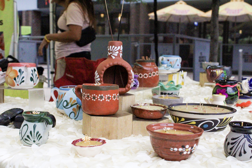 Vendor sells decorative beeswax candles