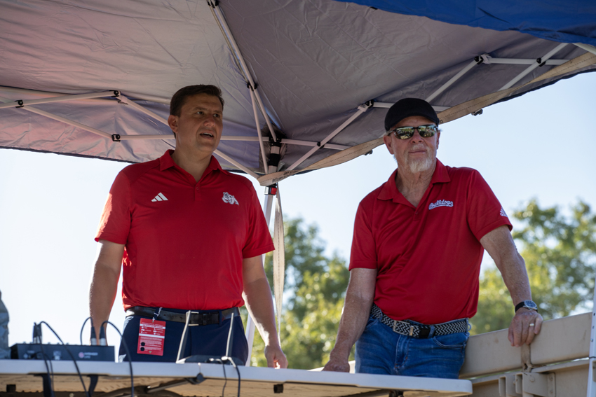 (Left to right) Voice of the Bulldogs Paul Loeffler, and former Fresno State Coach Pat Hill, commentating the Heroes Night flag football game, Sept. 14.