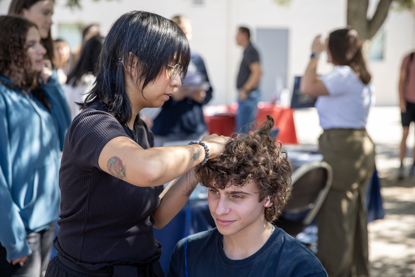 Jacob Mananian, '26, got his haircut by Paul Mitchell instructor.