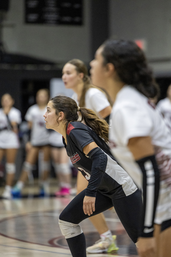 Libero Danielle Arndt, '26, runs to make the first pass on offence.