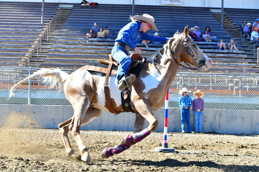 Rynna Silva, '25, competes in pole bending.