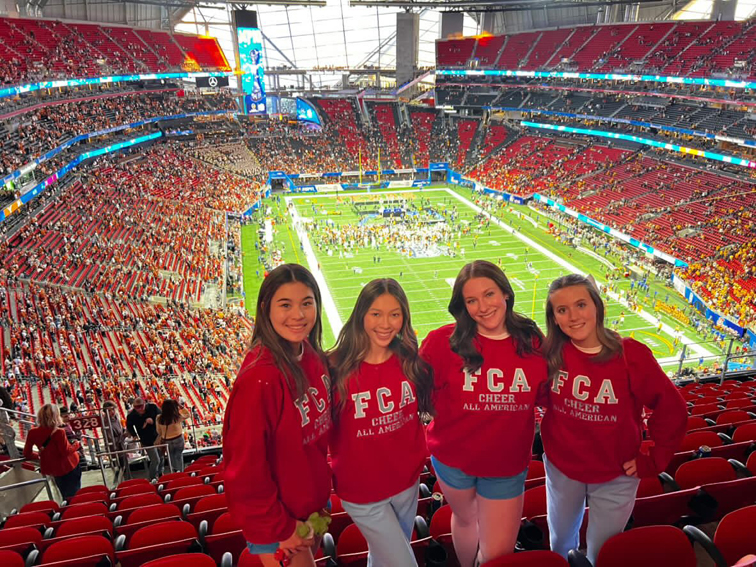 Fresno Christian cheerleaders bond. through their experiences at the Texas vs. Arizona football game.