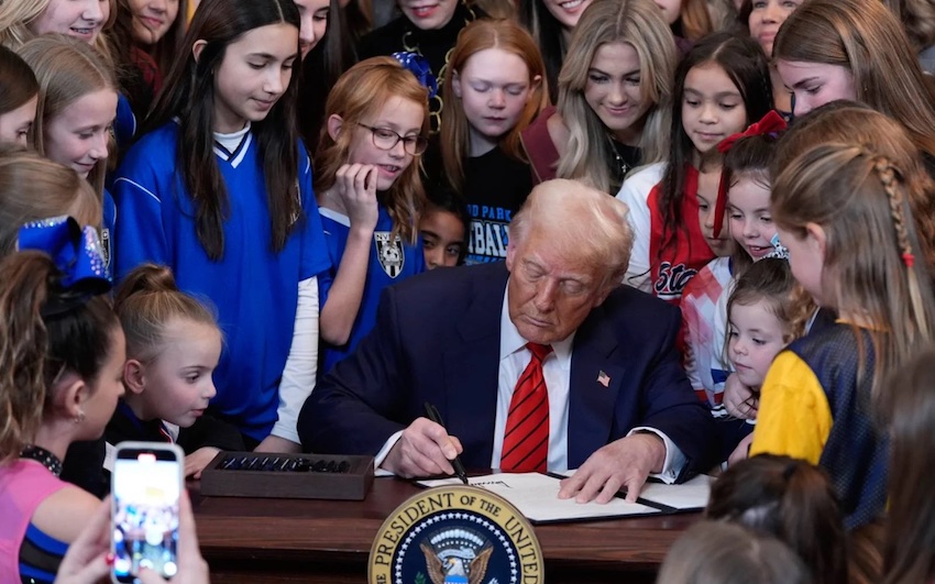 President Trump signs executive order “Keeping Men Out of Women’s Sports” with young female athletes watching to celebrate National Girls and Women in Sports Day, Feb. 5. (FMT)