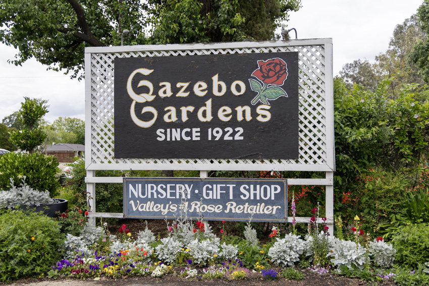 Gazebo Gardens sign at the entrance welcoming patrons 