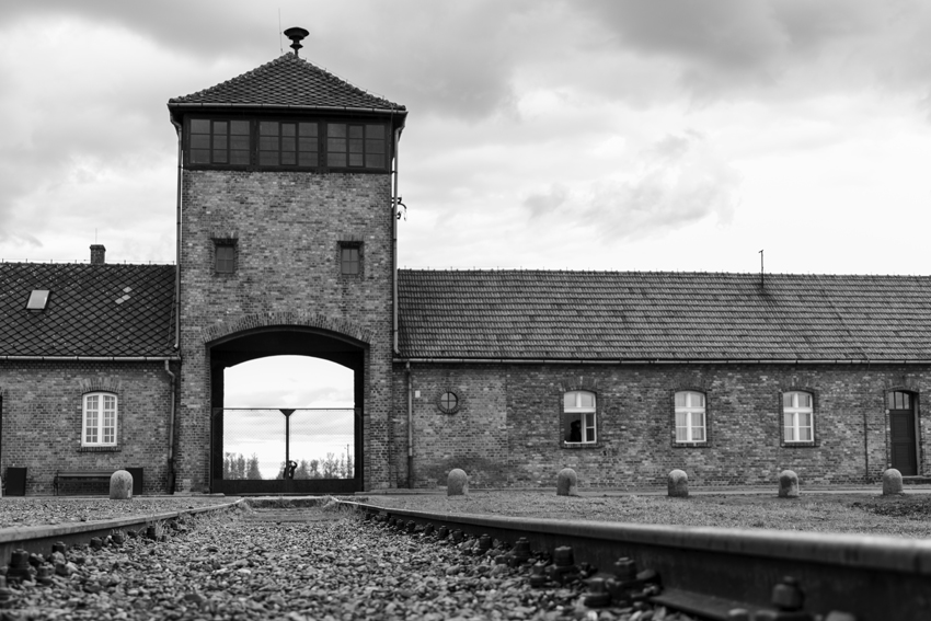 Remnants of Birkenau still exist today with the iconic railway going into the camp.