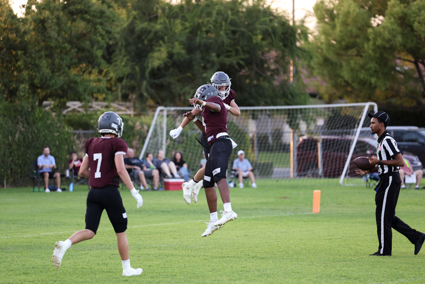 Alex Asatrian, '27, celebrates touchdown with Levi Eurich, '28.