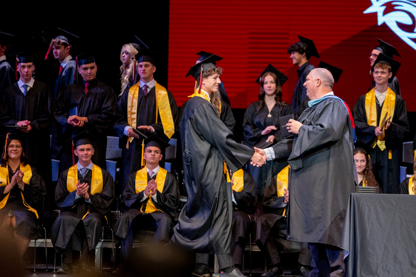44 graduating seniors receive their diplomas after 4 years of diligence.
