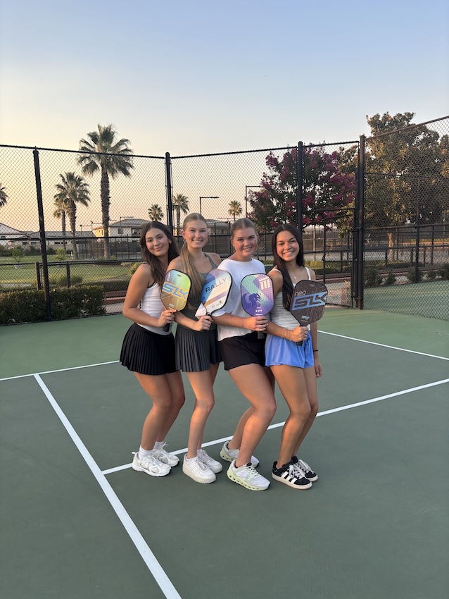 Seniors Natalie Garcia, Delaney Meyers, Georgia Karlson and Kennedy Schwab participate in senior class pickleball nights to bond with their class going into the fall semester.