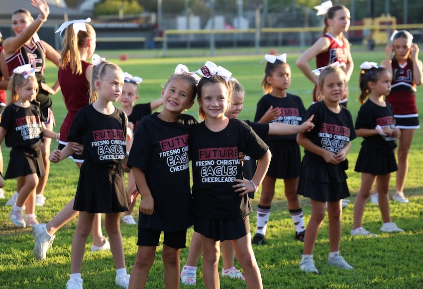 Little Eagle Cheerleaders take the field for FC's annual cheer clinic on the biggest night of the year.