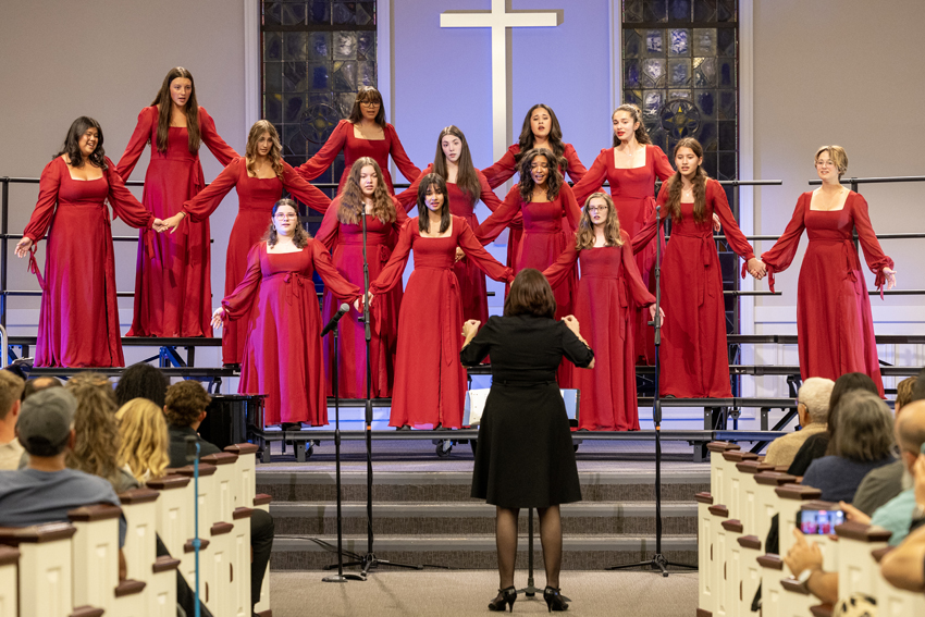 During the song "Lineage" the Women's Ensemble holds hands to represent family. 