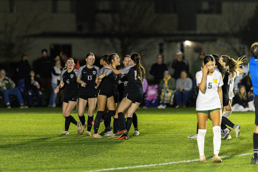 The girls soccer team is close knit due to consistent time spent together.